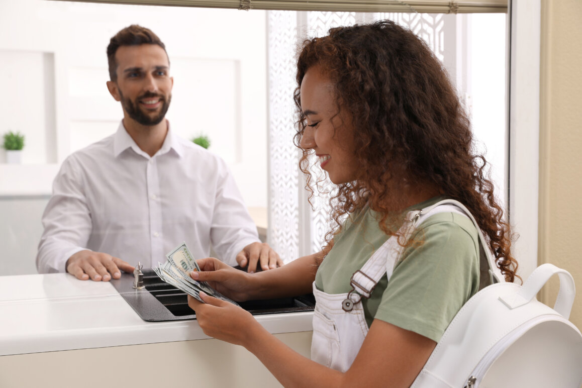 Woman making a transaction at a bank.